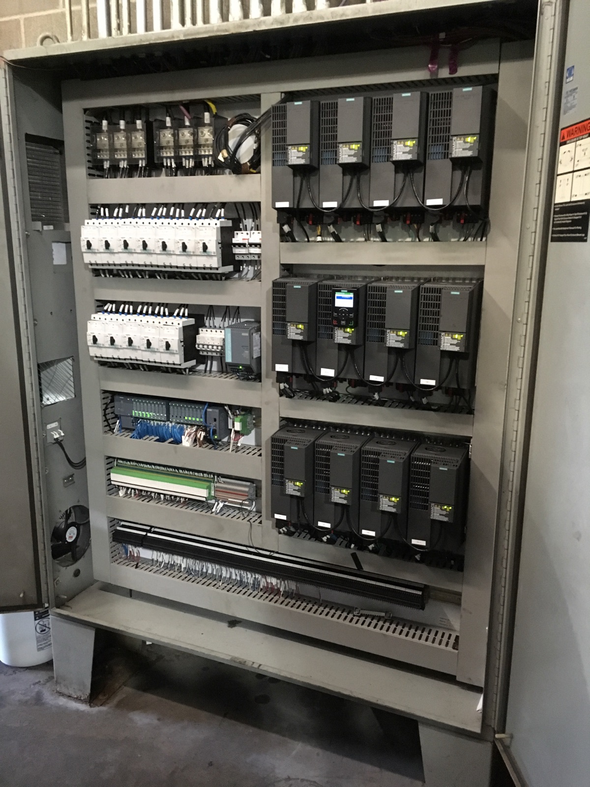 The same panel rebuilt with Siemens SINAMICS drives and organized wiring